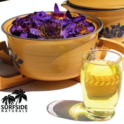 Bowl of Whole Blue Lotus Flowers and a Glass of Tea