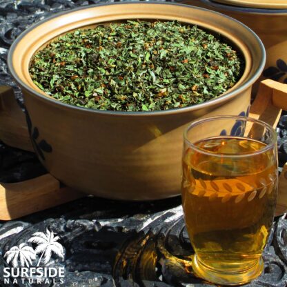 Bowl of Calea Zacatechichi Leaf and Flower and a Glass of Tea