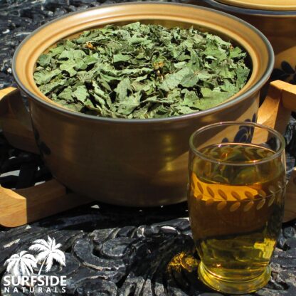 Glass of Calea Zacatechichi Tea and Bowl of Leaves