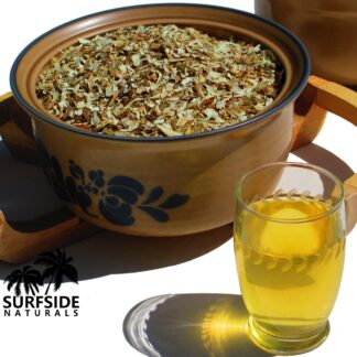 Bowl of White Lotus Flowers and a Glass of Tea